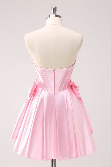 Vestido de fiesta corto con escote en A sin tirantes y corsé en color rosa con lazos